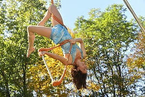 Nimble Arts performer on a trapese